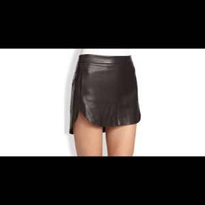 Michelle Mason black leather mini skirt.
